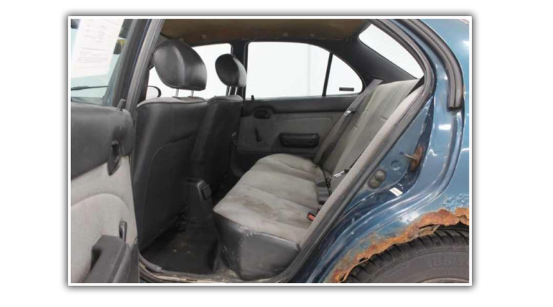 Illustration for article titled Even Rusty Beater Geo Prizms Deserve Nice Photo Shoots At The Dealership